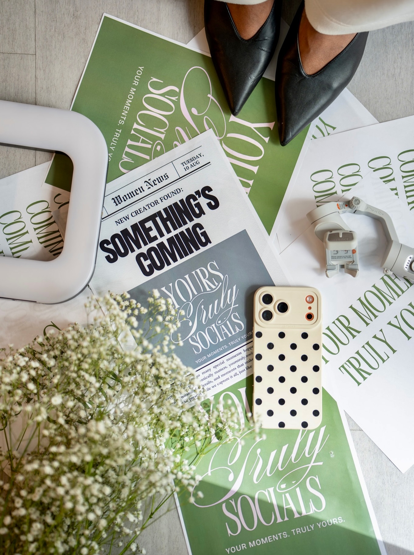 Yours Truly Socials stationery, flowers, an iPhone, and creative details from the brand’s story