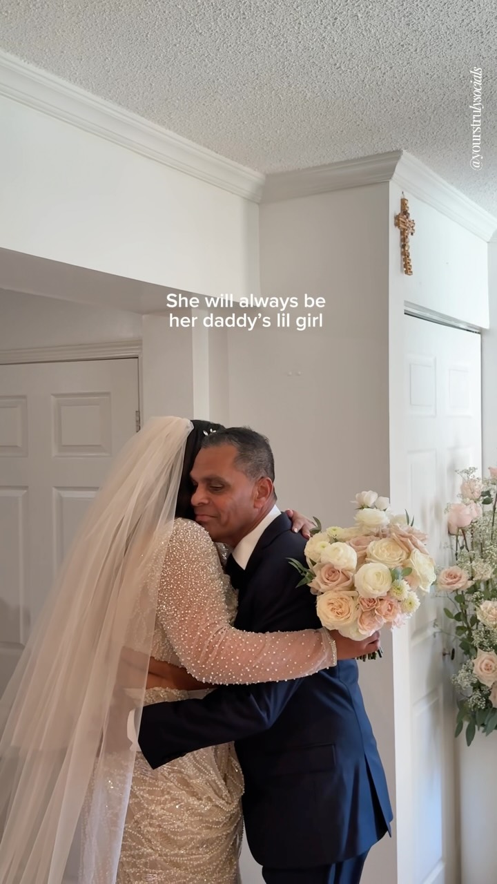 A heartfelt first-look moment between a bride and her father